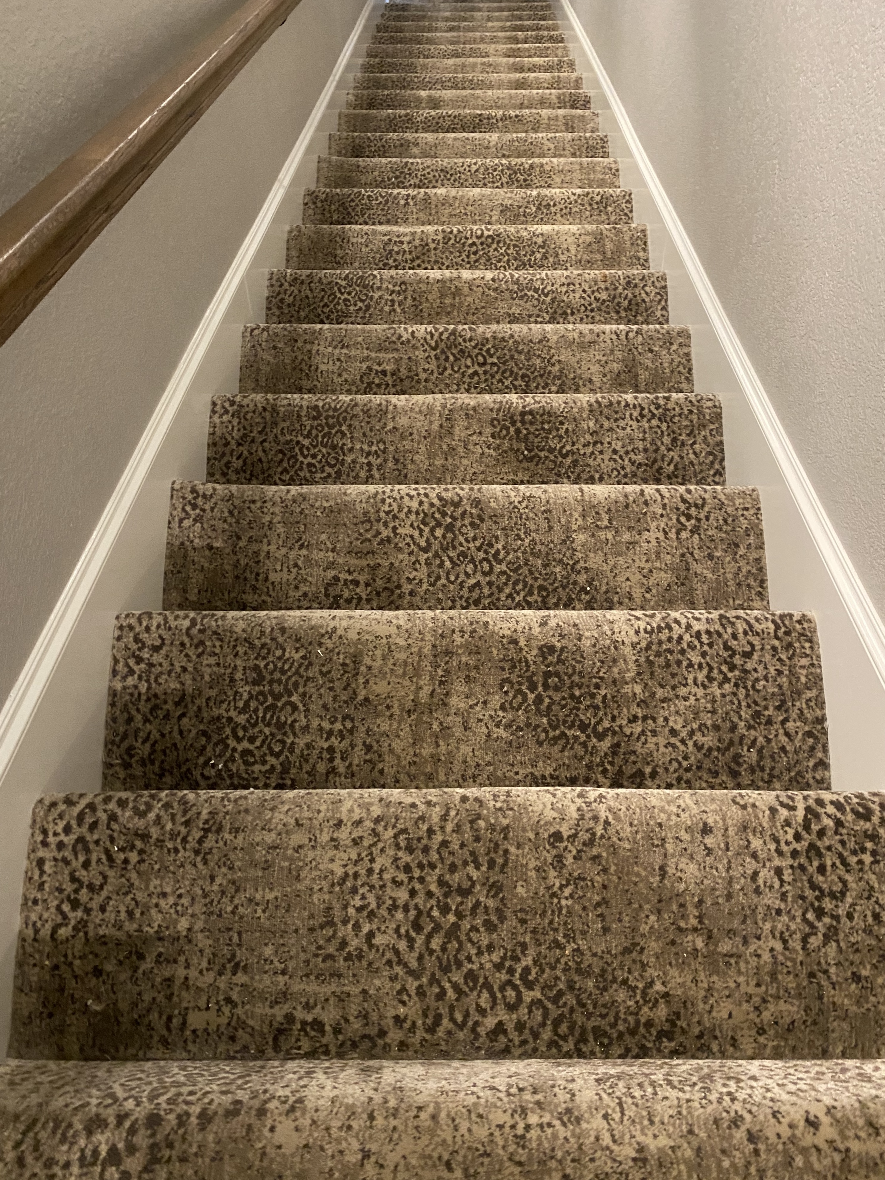 Patterned carpet installation on residential stairs in Wise County home