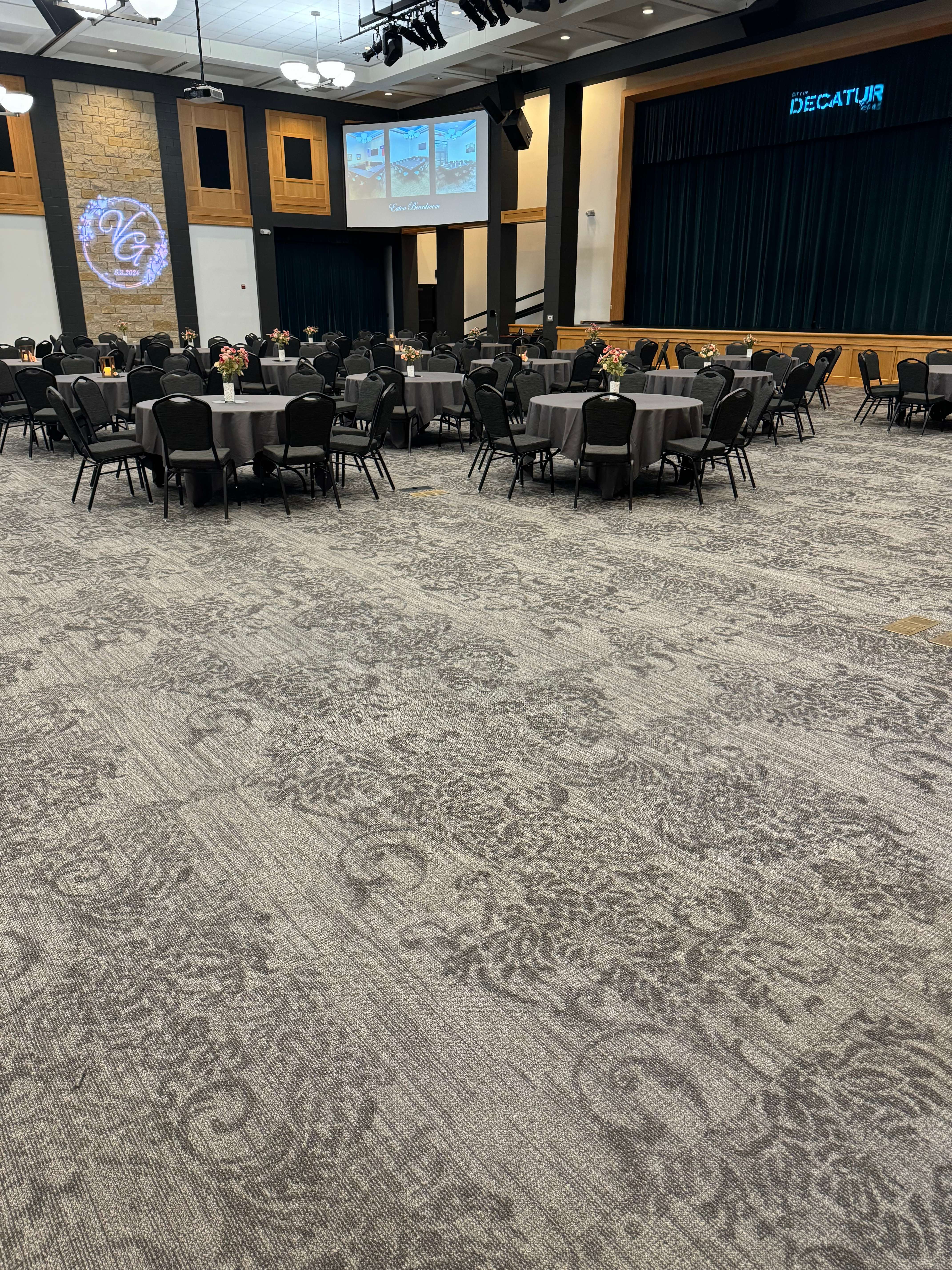 Commercial event space with neutral patterned carpet for conference and banquet facilities