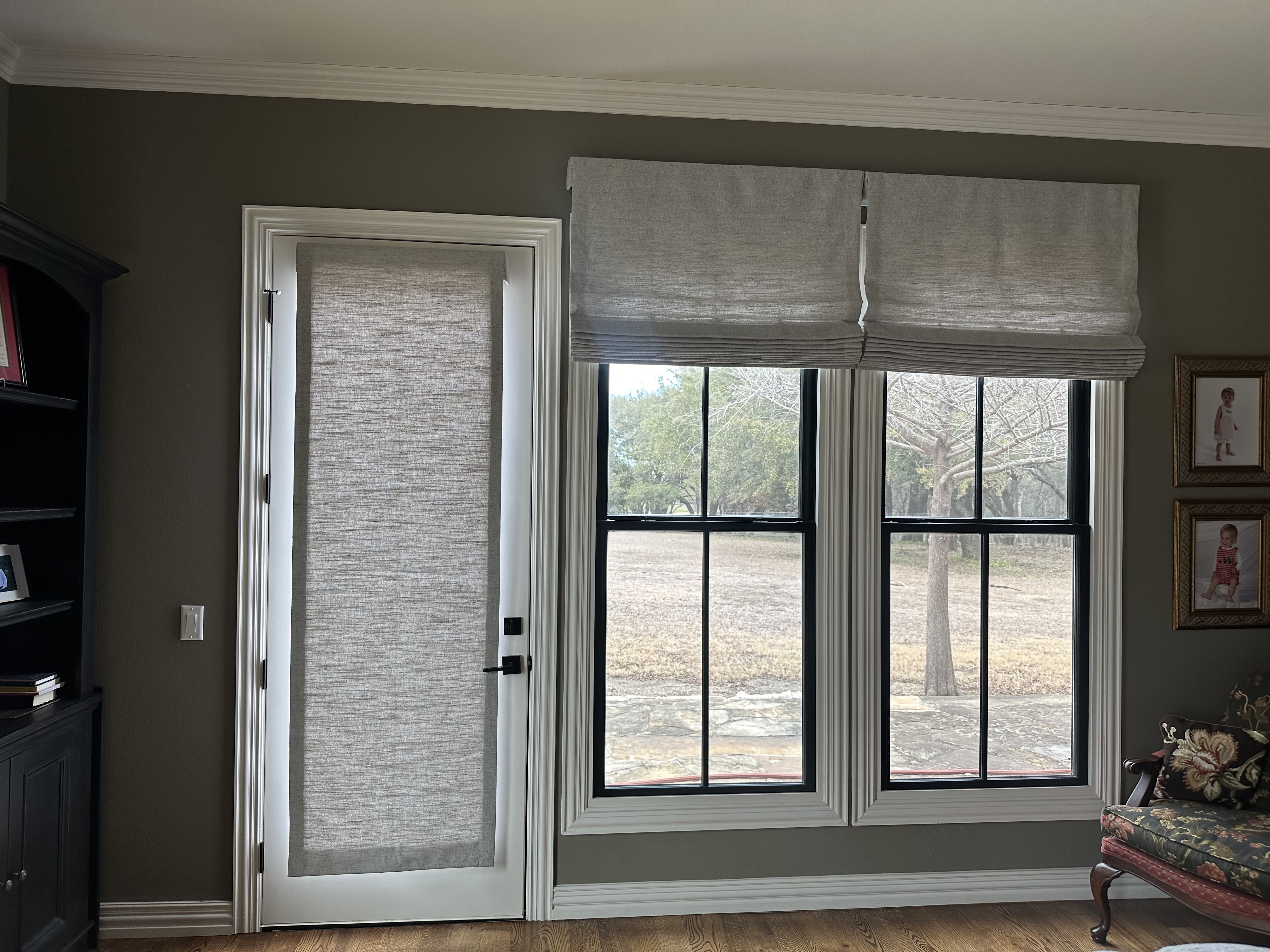 Cellular window shades with Roman shade treatment and modern light fixtures in Wise County
